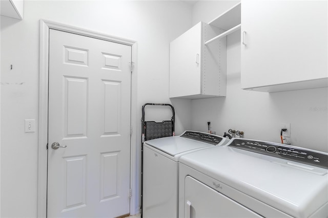 9458 SW 93rd Loop, Ocala, FL 34481 - laundry room with washer and dryer and cabinet space
