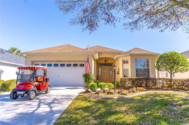 9458 SW 93rd Loop, Ocala, FL 34481 - view of front of house with a garage, concrete driveway, and stucco siding