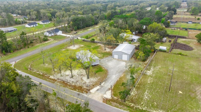 birds eye view of property with a rural view