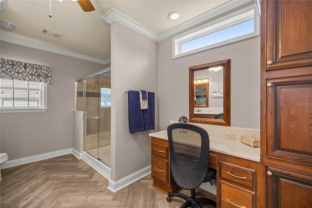 office area featuring visible vents, baseboards, a healthy amount of sunlight, and ornamental molding