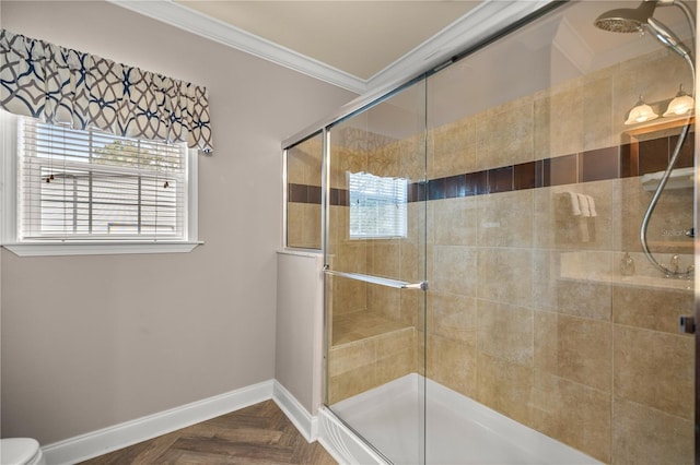 bathroom featuring crown molding, baseboards, and a shower stall