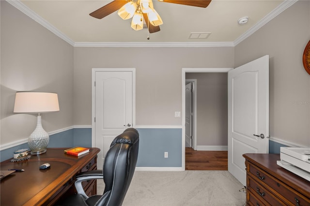 office space with visible vents, ceiling fan, crown molding, and baseboards