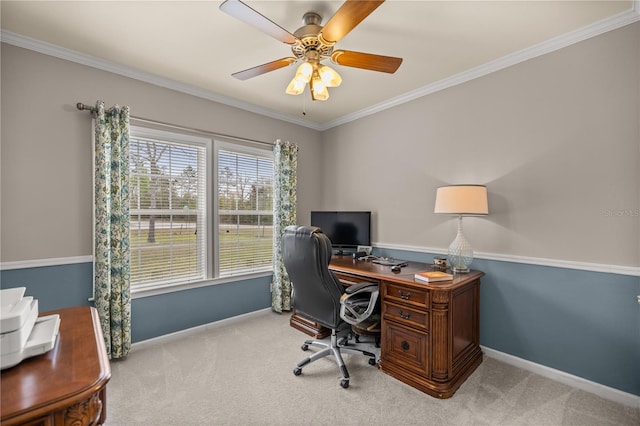 carpeted office space featuring a ceiling fan, baseboards, and ornamental molding