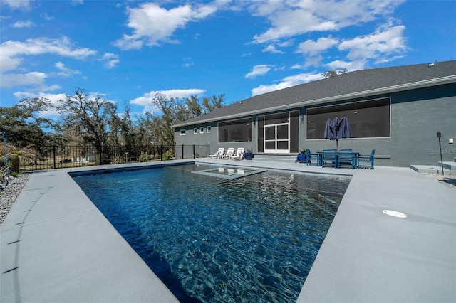 view of swimming pool with a fenced in pool, a patio, and fence