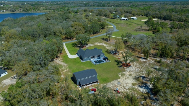 bird's eye view with a view of trees and a water view