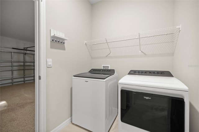 laundry room featuring laundry area, baseboards, and independent washer and dryer