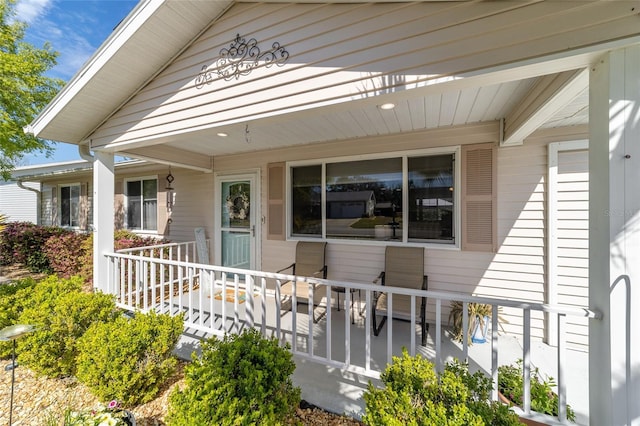 view of exterior entry with covered porch