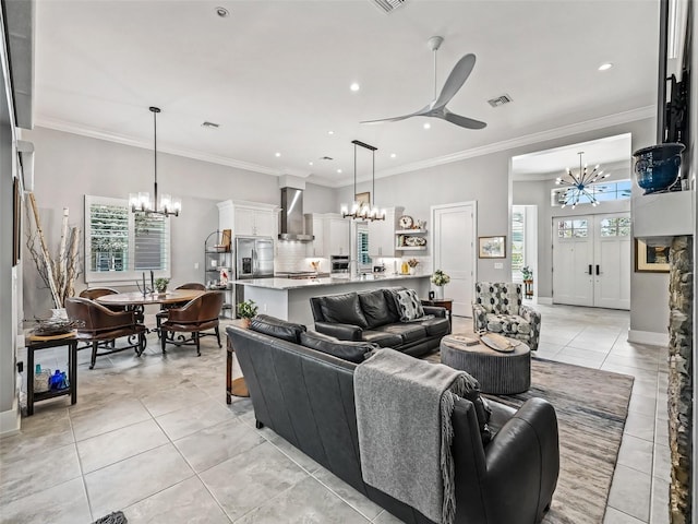 living area with light tile patterned floors, visible vents, and a healthy amount of sunlight