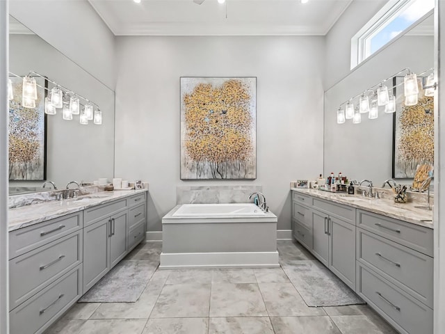 bathroom featuring ornamental molding, two vanities, and a sink