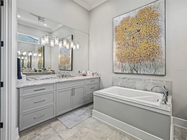 full bathroom featuring a garden tub, ornamental molding, and vanity