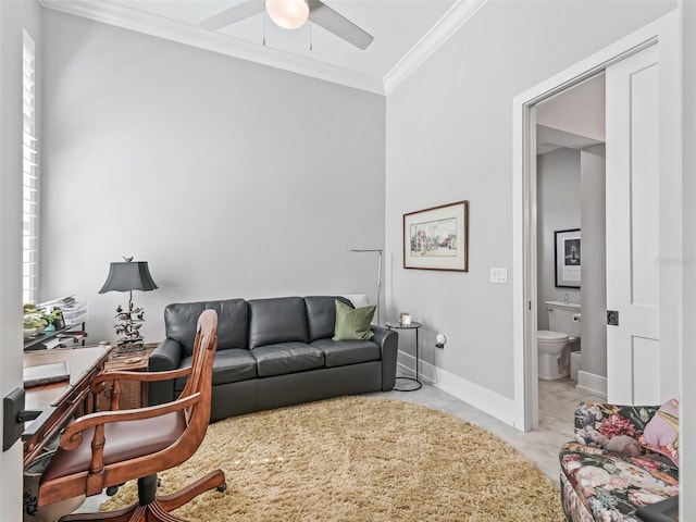 office space with ceiling fan, crown molding, and baseboards