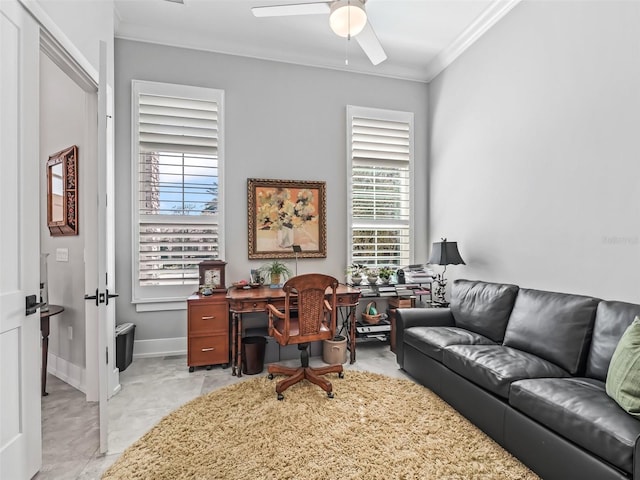 office space with baseboards, a ceiling fan, and ornamental molding