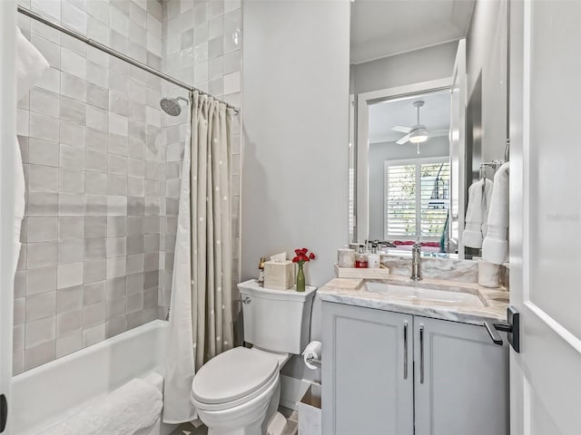 bathroom featuring shower / bathtub combination with curtain, toilet, a ceiling fan, crown molding, and vanity