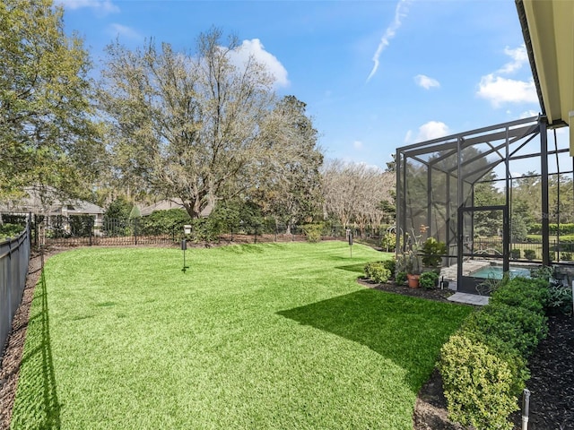 view of yard featuring a lanai, a fenced backyard, and a fenced in pool