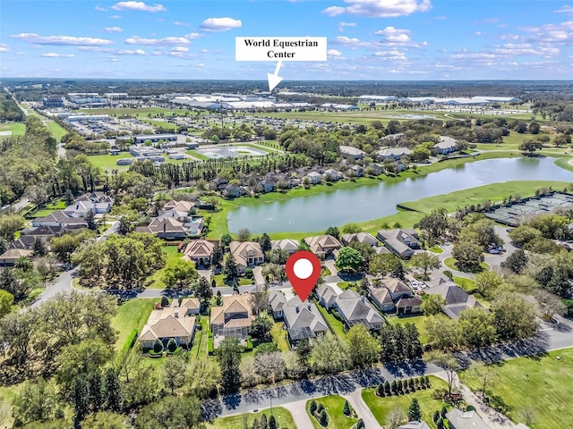 birds eye view of property featuring a residential view and a water view