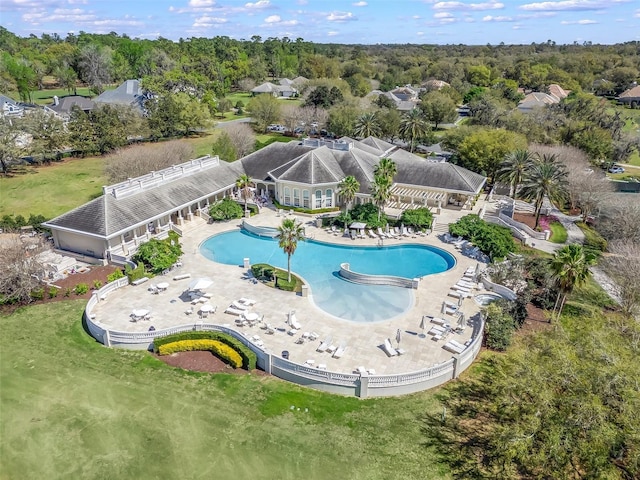 community pool with a patio area