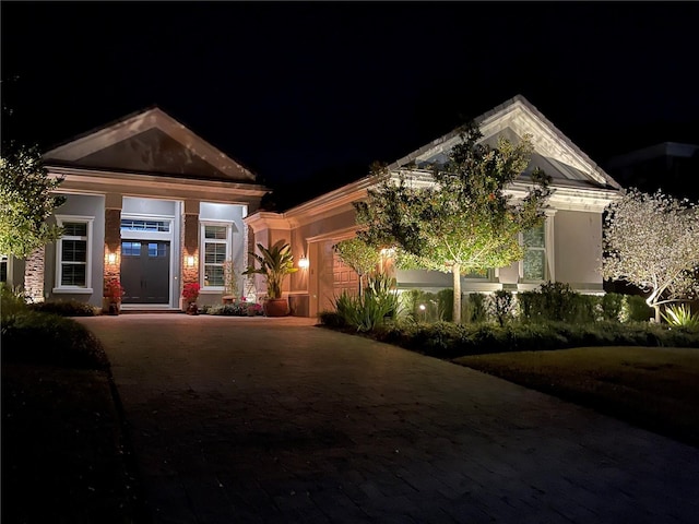 view of front facade featuring decorative driveway