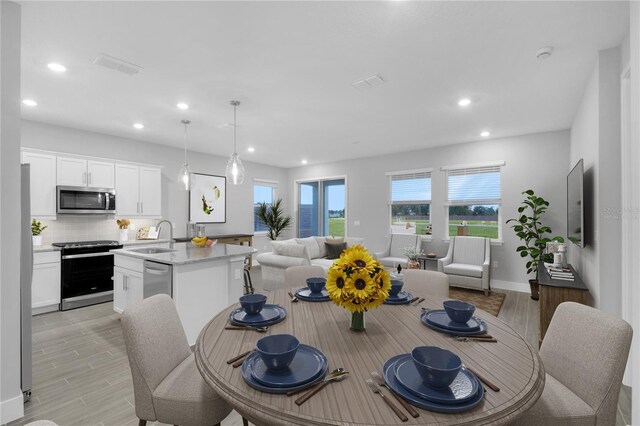 5270 NW 33rd Pl, Ocala, FL 34482 - dining area with recessed lighting, light wood-style floors, and baseboards