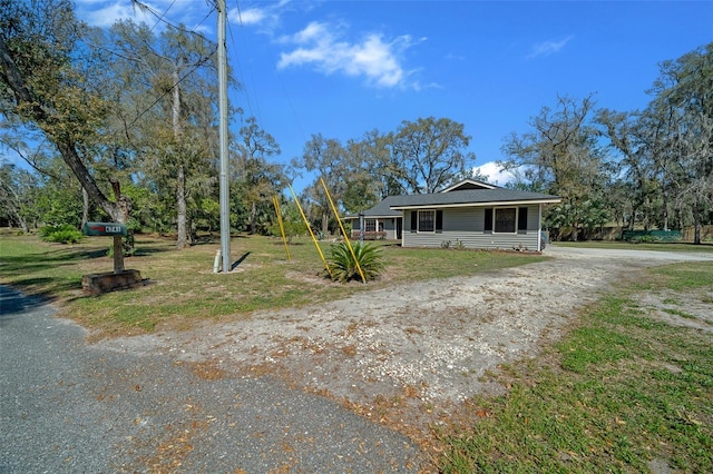 view of front of house featuring a front yard and driveway