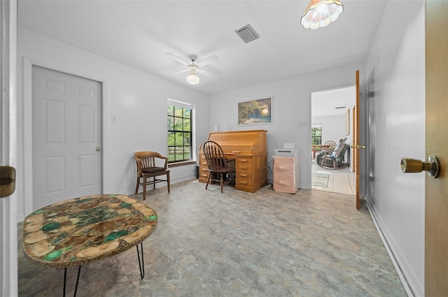 office featuring visible vents, baseboards, and ceiling fan