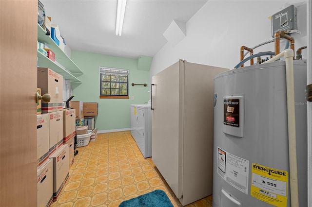 laundry room featuring laundry area, electric water heater, baseboards, and separate washer and dryer