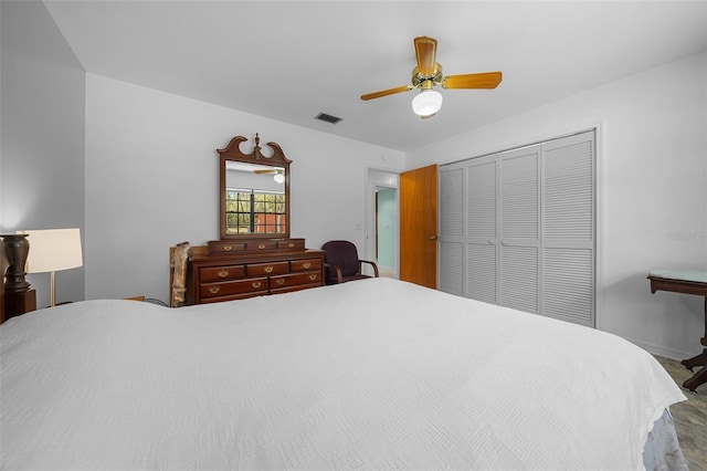 bedroom featuring baseboards, visible vents, a closet, and ceiling fan