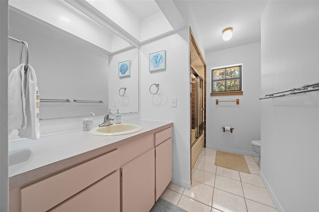 bathroom featuring vanity, baseboards, bath / shower combo with glass door, tile patterned flooring, and toilet