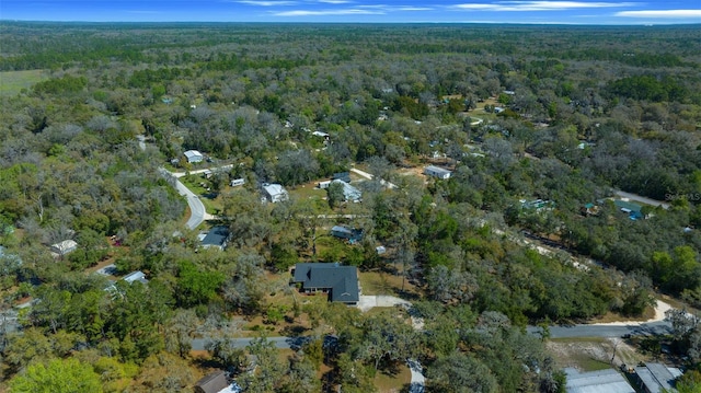 aerial view with a wooded view