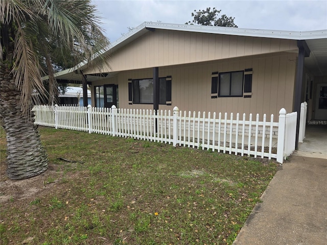 exterior space with a fenced front yard