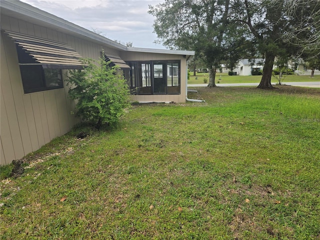 view of yard with a sunroom