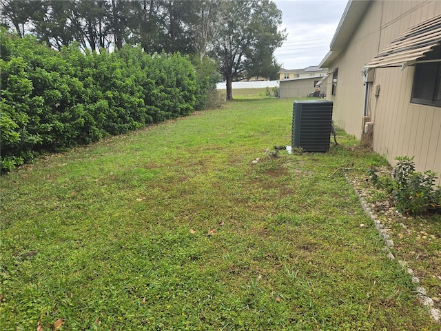 view of yard with central AC