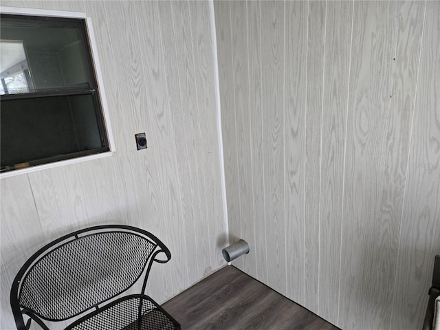 laundry area with dark wood-style flooring