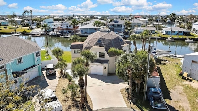 aerial view with a residential view and a water view