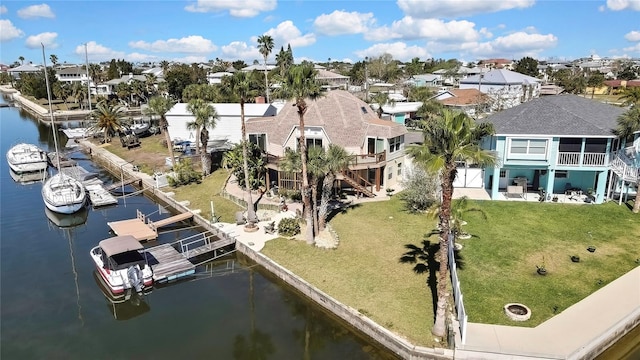 birds eye view of property with a residential view and a water view