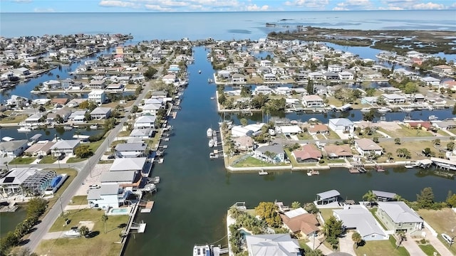 drone / aerial view with a water view and a residential view