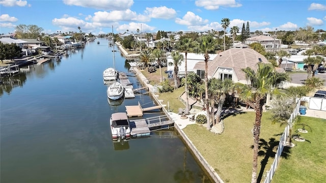 drone / aerial view with a residential view and a water view