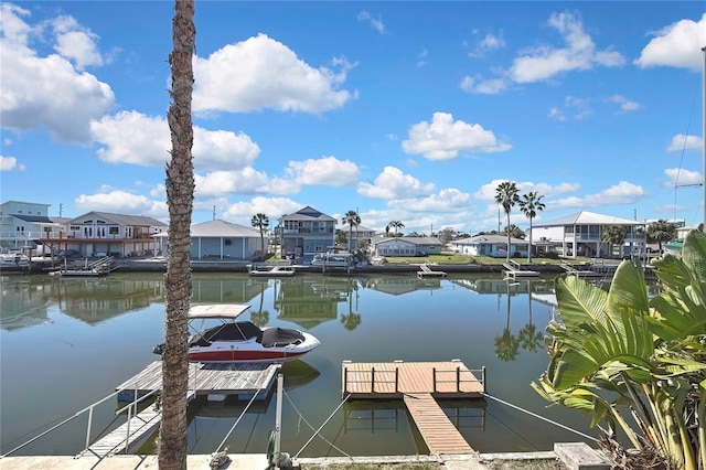 dock area featuring a residential view and a water view