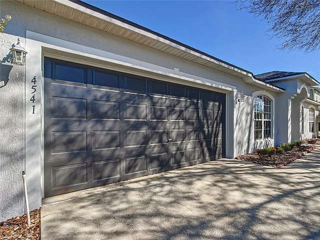 garage featuring driveway