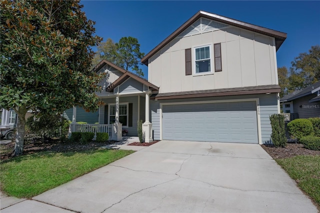 view of front of home with driveway, a garage, a porch, and board and batten siding