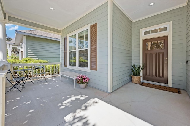 doorway to property featuring a porch