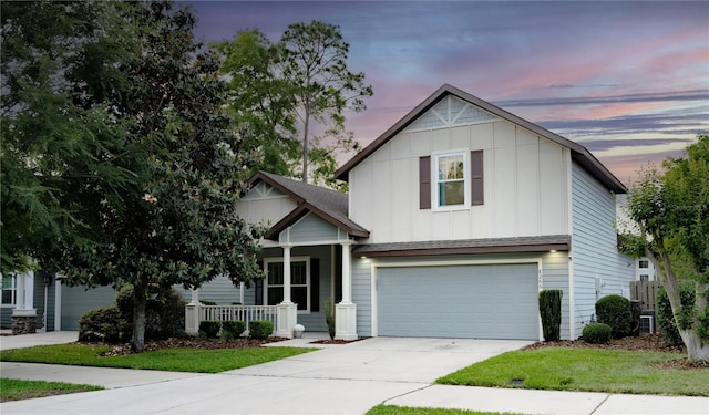 view of front of property featuring central AC unit, driveway, board and batten siding, an attached garage, and a porch