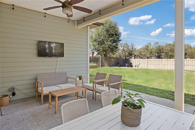 deck featuring a lawn, a fenced backyard, ceiling fan, and a patio