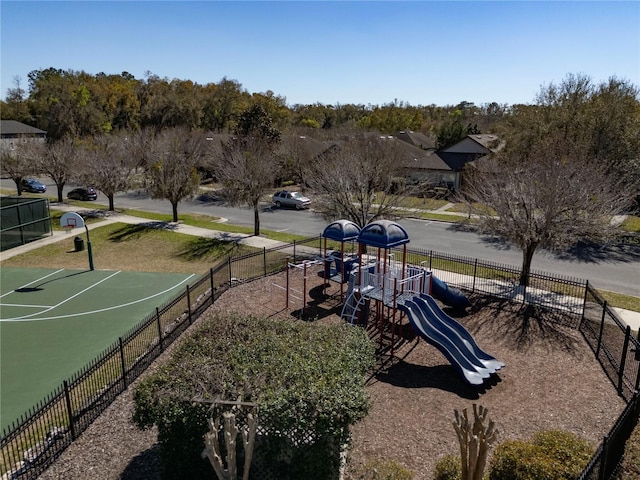 view of property's community with fence and playground community