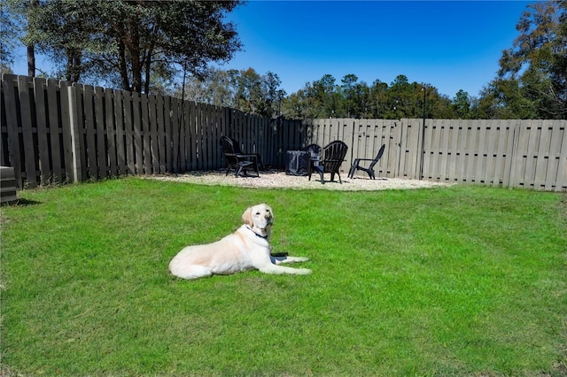 view of yard with a fenced backyard