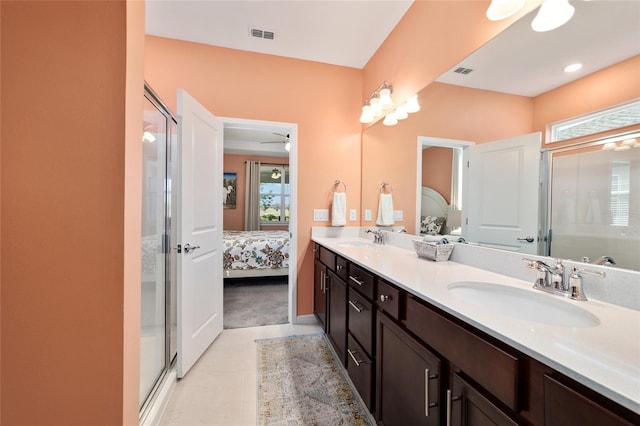 full bath featuring a sink, a shower stall, and ensuite bathroom