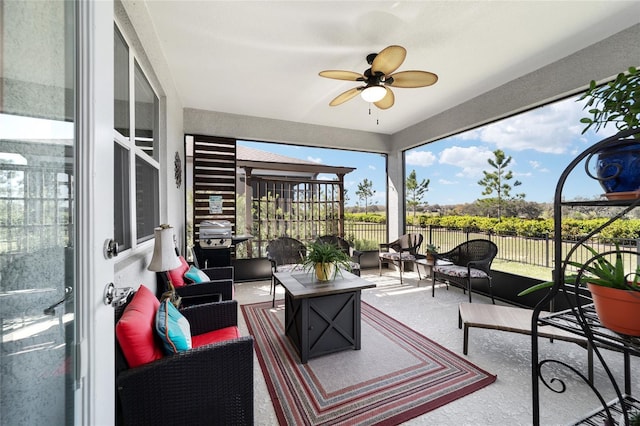 sunroom with a ceiling fan