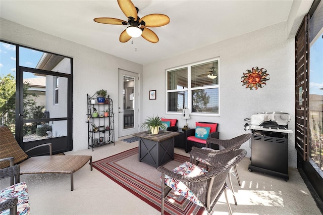 interior space featuring light colored carpet and ceiling fan