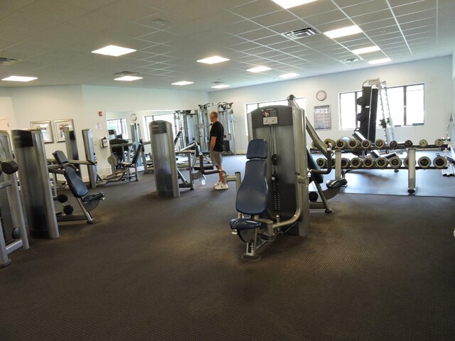 exercise room featuring a drop ceiling and visible vents