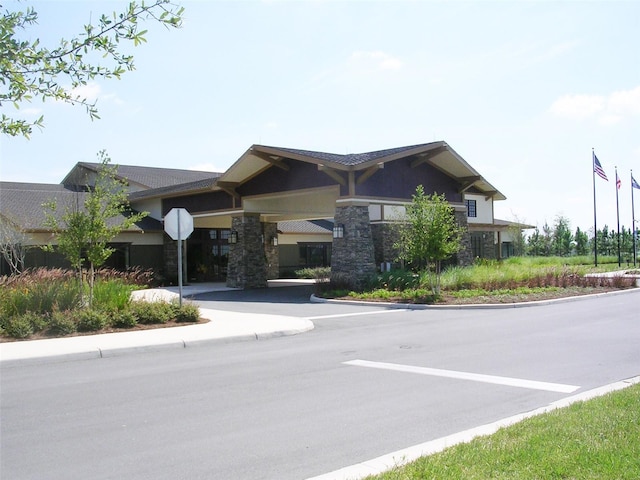 exterior space featuring traffic signs and curbs