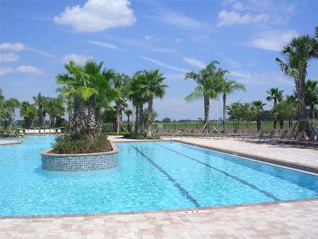 view of pool featuring a patio area and fence